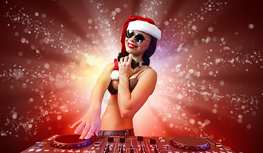圣诞节时女性穿戴的DJ 十二月 圣诞老人 耳机 乐趣 夜店图片