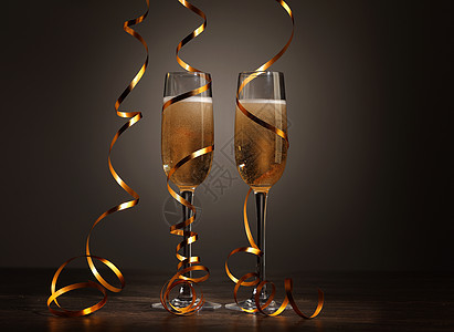 新年派对上香槟的玻璃杯 丝带 冬天 圣诞节 圣诞灯饰图片