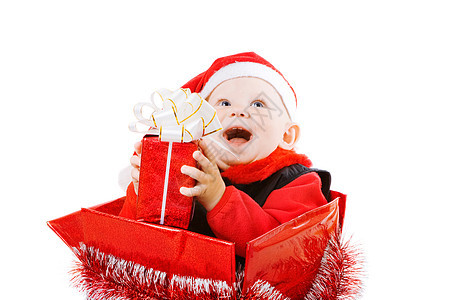 在圣诞节盒里带礼物的婴儿 帽 庆典 丝带 快乐的图片