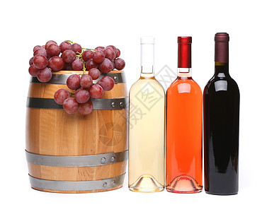 木制的酒瓶和成熟的葡萄图片