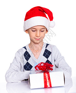 带着礼物盒的圣诞老人帽子小男孩 可爱的 圣诞节 冬天图片