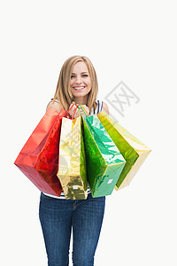 带着购物袋的可爱年轻女子肖像 零售 可爱的 快乐的图片