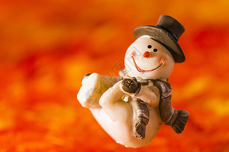红背景的快乐雪人 十二月 帽子 冬天 卡通片 庆典 霜图片