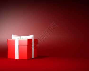 带白丝带的红礼物盒和在红色背景上鞠躬的红礼盒图片
