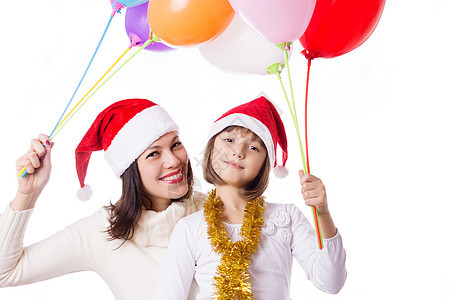 带着气球和圣诞帽子微笑的母亲与女儿一起微笑图片