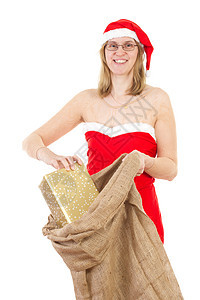 用黄麻袋和金礼 向圣诞夫人微笑图片