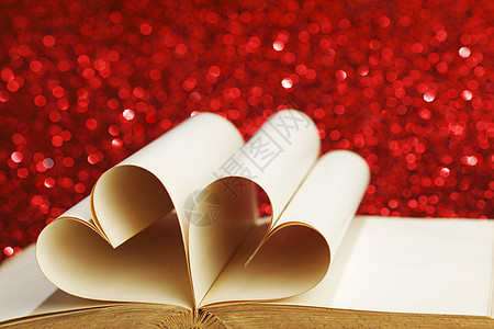 书里面的心 假期 闪光 浪漫 爱 红色的背景图片