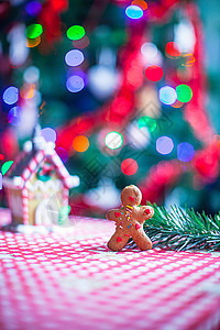 姜饼店和圣诞树灯的关闭者背景 糖果 姜汁屋和圣诞树灯 装饰风格 庆典背景图片
