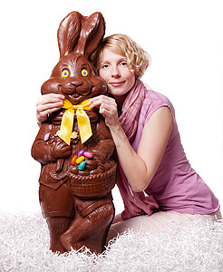 巧克力复活节兔子的金发女孩调整图片