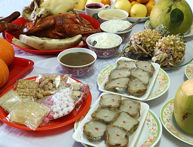 为中国新年文化提供各种食物 水果 鸭子 月球图片