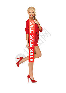 穿红裙子 有销售标志的漂亮女人 优美 购物狂 高跟鞋图片