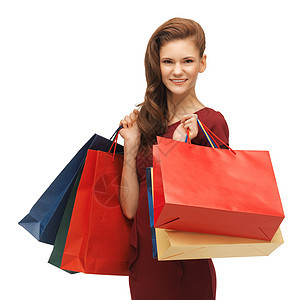 穿红色衣服和袋装购物袋的少女 时髦 零售 顾客图片
