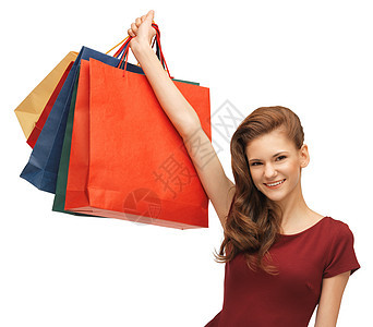 穿红色衣服和袋装购物袋的少女 零售 时髦 消费者图片