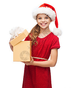 带着礼物盒的圣塔帮手帽子中的笑笑女孩 快乐图片