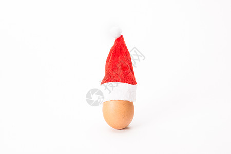 圣诞鸡蛋 托盘 白色的 假期 帽 惊喜 圣诞老人 红色的 食物背景图片