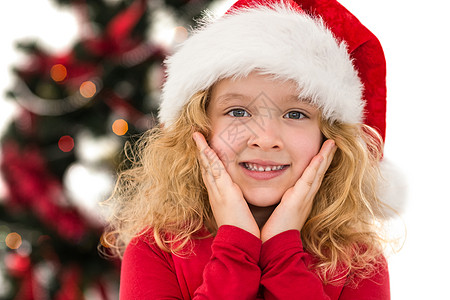 喜悦的小女孩在镜头中微笑 剪下 圣诞帽 风流 快乐图片