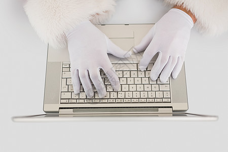 在笔记本电脑上打字 双手 圣诞节的时候 技术 庆祝背景图片