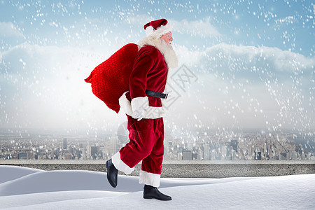 在雪地上站立的圣塔复合图像 白雪皑皑 圣诞老人 城市景观 阳台图片