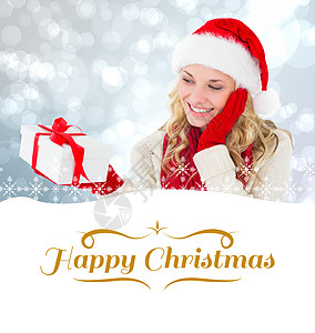 喜悦金发美女和礼物的复合形象 圣诞快乐 框架 取景图片