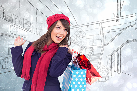 冬季衣服中带着购物袋的美红褐色快乐综合形象 吃了一惊 购物狂图片