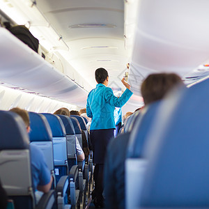 国内飞机内有乘客座椅 旅游 座位 舱 商业 行李高清图片