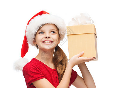 带着礼物盒的圣塔帮手帽子中的笑笑女孩 可爱的图片