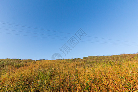 山区地貌 精彩的 植物 草地 假期 云 首脑 天空 太阳图片