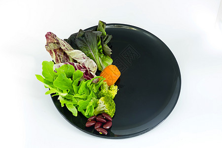 盘子上的蔬菜沙拉 用空白丝菜夹条来形容 辣椒图片