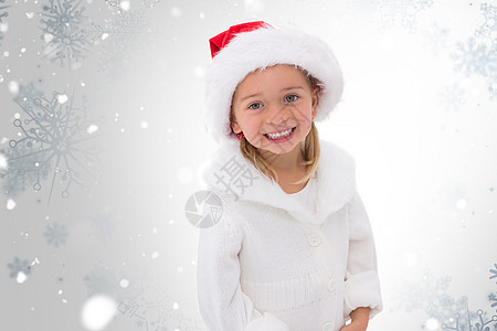 穿着圣塔帽的可爱小女孩的复合形象 冬天 圣诞节的时候图片