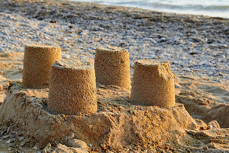 沙下高塔 旅行 蓝色的 雕塑 美丽的 太阳 自然 自由的 海滩图片