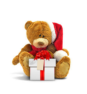 泰迪熊和带红丝带的礼物盒图片