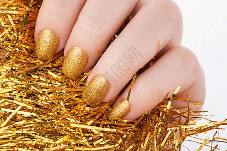 美丽的金色美甲 画 指甲 纤维 时尚 覆盖 美学背景图片