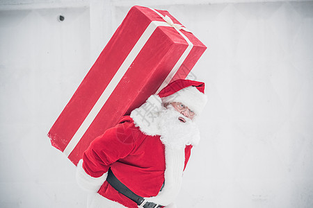 带礼物盒的圣诞老人 快乐的 圣诞节的时候 问候语 庆祝 快活的 雪图片