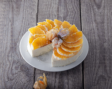 芝士蛋糕装饰着橙子和植物 香薰 生日 不健康的饮食 财富图片