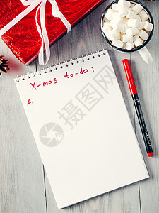 圣诞礼品购物规划清单 躺着 马克杯 去做 笔记 写背景图片
