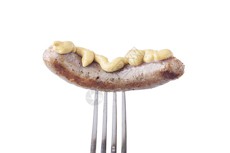 叉子香肠银叉子上的纽伦堡香肠 棕色的 芥末 食物 小吃 炙烤背景