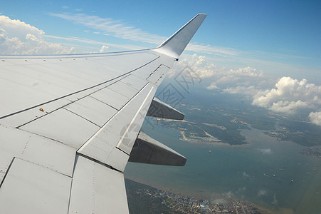 飞机 晴天 运输 阳光 乘客 空气 云 航空图片