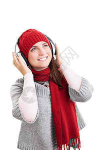 带着耳机穿着冬衣微笑的女孩图片
