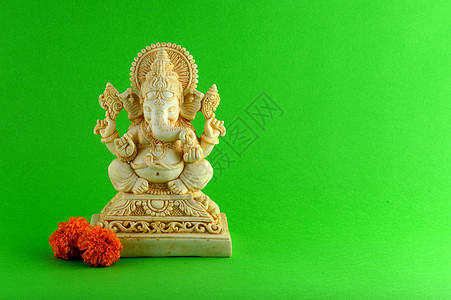 印度神象头神 在绿色背景上的象头神偶像 手图片