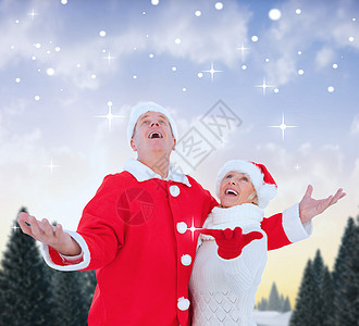 喜庆成年夫妇的复合形象 寒冷的 金发女郎 圣诞帽 夫妻 冰图片