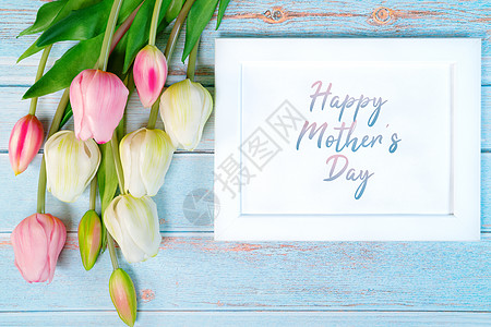 快乐母亲的一天概念 白相框和花朵图片