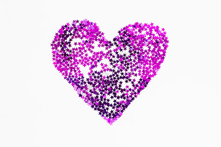 由闪亮的紫色金黄色卷心菜所制成的心脏 闪耀的符号背景图片