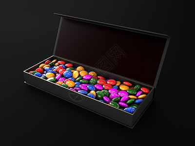豪华盒子里的彩色巧克力在深色 background3上被隔离图片