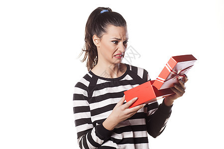 拿着礼物在手上的恶心女孩 失望 女士 圣诞节 沮丧的图片