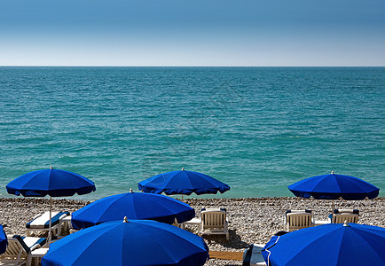 尼斯海滩带雨伞 海尔 夏天 苏尔 热带 法国 晴天 海岸图片