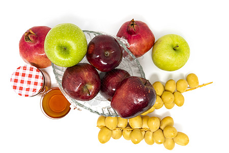 犹太新年 传统符号 玻璃罐中的蜂蜜 石榴 日期 红绿苹果 素食主义者 甜的图片
