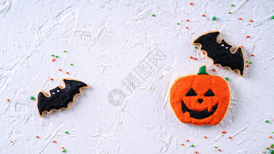万圣节节节日喜庆装饰式冰糖饼干的顶端视图 食物 橙子背景图片