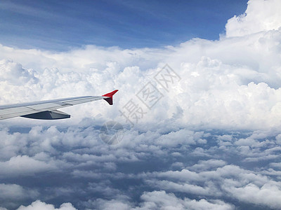 飞云上方的飞机机翼 地球 高的 速度 空气 车辆 商业图片