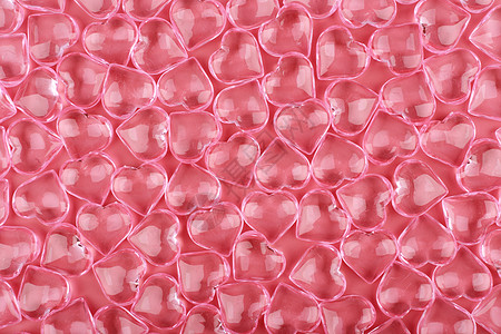 与透明玻璃心反对粉红色背景的模式 爱的概念和圣瓦伦丁大图片