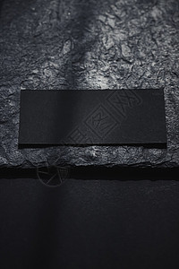 暗石板面背景和阳光阴影的黑名片 豪华品牌平板套牌和模型品牌设计标志性身份设计 小样 笔记图片